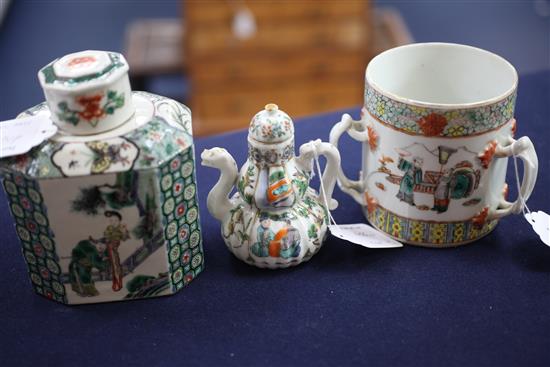 A Chinese enamelled porcelain tea caddy and cover, a wine pot and cover and a three handled tyg, 19th century, 11cm - 15cm